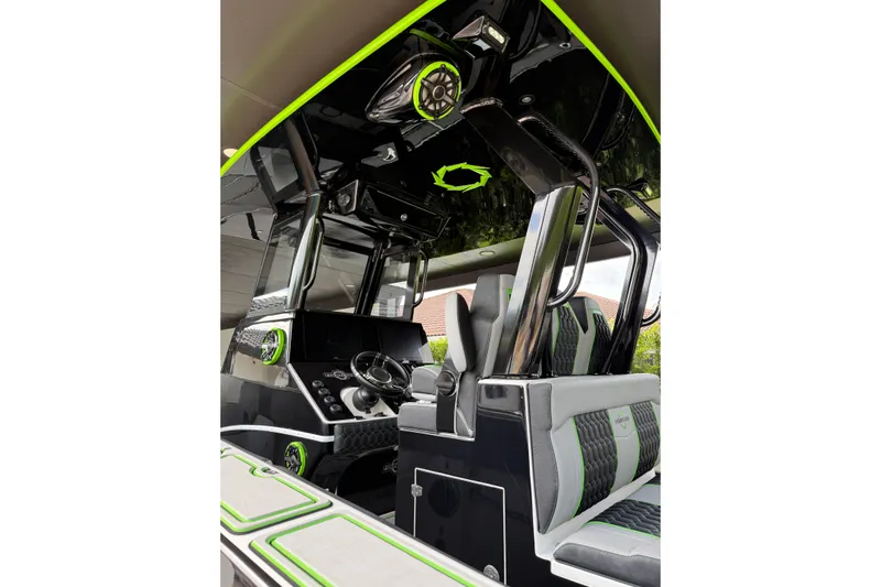  Yacht Photos Pics 2006 Fountain 38 CC Tournament Edition boat interior with modern black and green design.