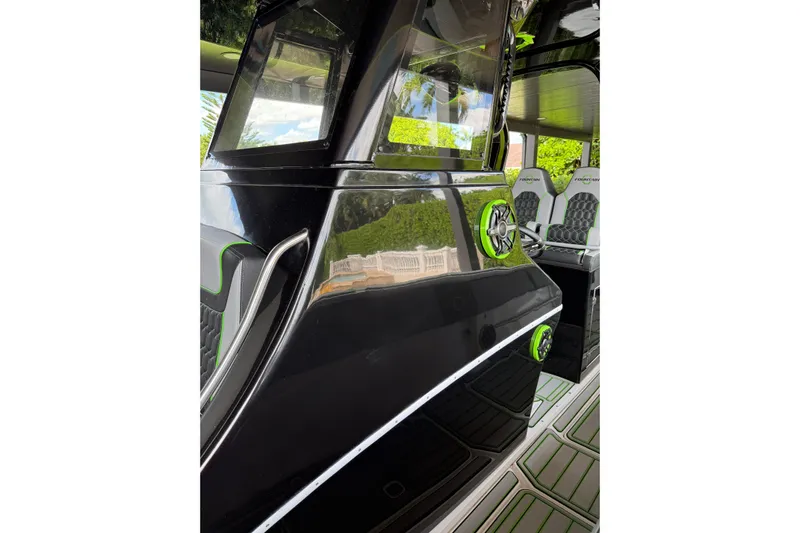  Yacht Photos Pics 2006 Fountain 38 CC Tournament Edition boat interior with sleek black design and green accents.