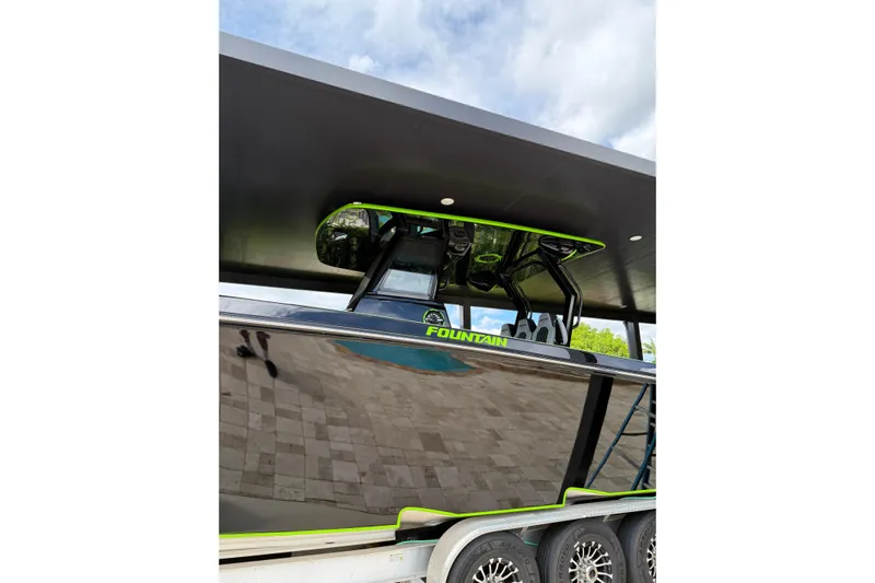  Yacht Photos Pics 2006 Fountain 38 CC Tournament Edition boat with sleek black design and neon accents.