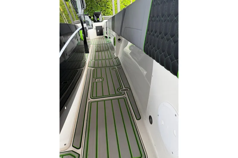  Yacht Photos Pics 2006 Fountain 38 CC Tournament Edition boat interior with green-accented flooring and seating.