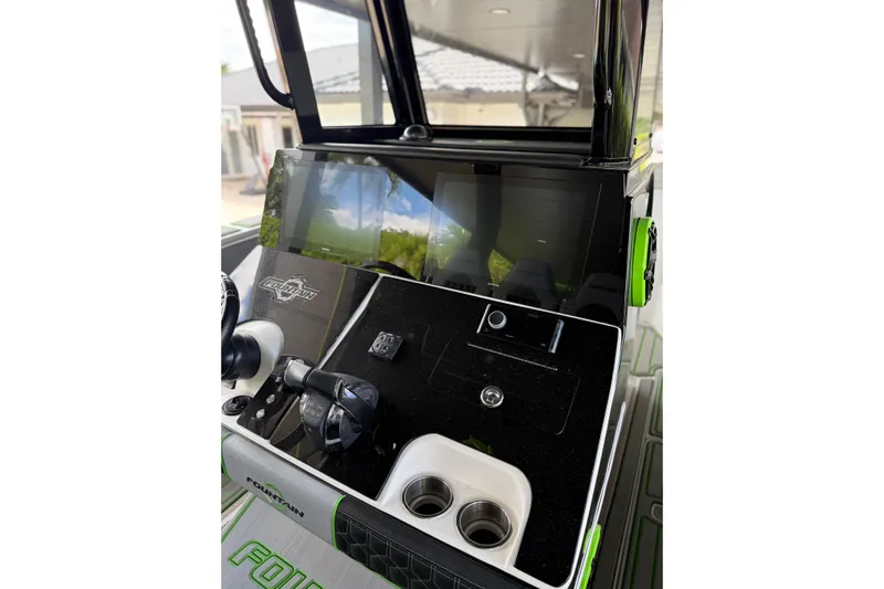  Yacht Photos Pics Console of 2006 Fountain 38 CC Tournament Edition boat with modern controls and display.