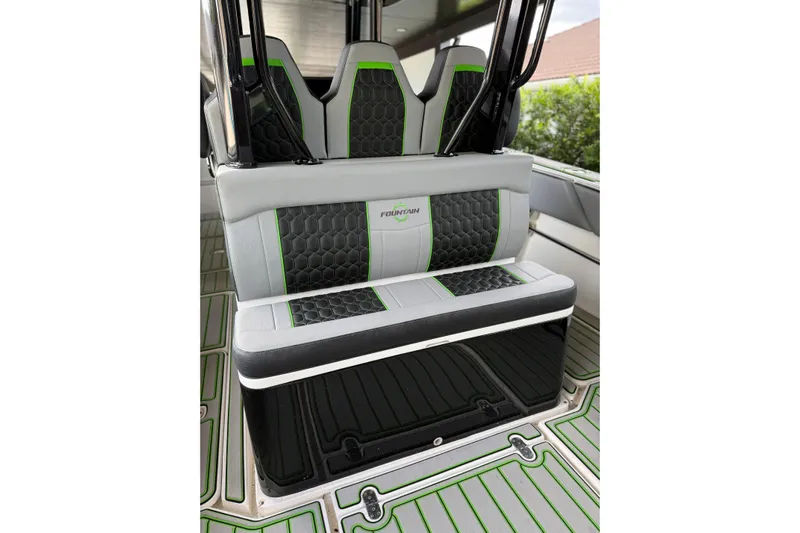  Yacht Photos Pics 2006 Fountain 38 CC Tournament Edition boat interior with stylish seating and green accents.