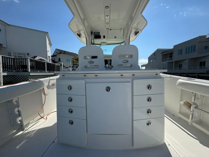  Yacht Photos Pics 2011 Everglades 325 Center Console boat interior with storage compartments and seating.