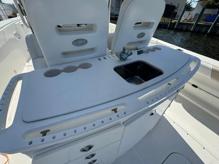  Yacht Photos Pics 2011 Everglades 325 Center Console boat with sink and storage on deck.