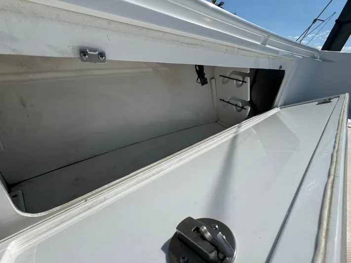  Yacht Photos Pics Storage compartment of 2011 Everglades 325 Center Console boat, open and empty.