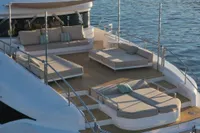 Luxurious 2018 Benetti 95 Delfino yacht deck with elegant seating and ocean view.