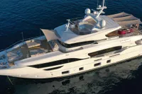 Luxurious 2018 Benetti 95 Delfino yacht cruising on serene blue waters.