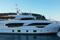 Luxury 2018 Benetti 95 Delfino yacht cruising on serene waters.