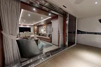 Luxurious interior of 2018 Benetti 95 Delfino yacht with elegant seating and dining area.