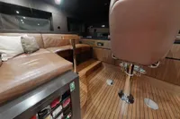 Luxurious interior of 2018 Benetti 95 Delfino yacht with leather seating and wooden flooring.