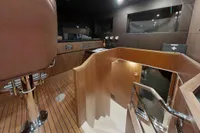 Luxurious interior of 2018 Benetti 95 Delfino yacht with wooden finishes and modern design.