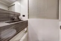 Luxury bathroom interior on 2018 Benetti 95 Delfino yacht, featuring modern design and sleek finishes.