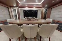 Luxurious dining area on 2018 Benetti 95 Delfino yacht with elegant decor and seating.