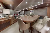 Luxurious interior of 2018 Benetti 95 Delfino yacht with elegant dining area and modern decor.