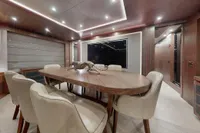 Luxurious interior of 2018 Benetti 95 Delfino yacht with elegant dining area.