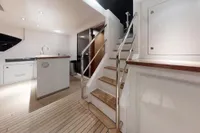Luxurious interior of 2018 Benetti 95 Delfino yacht with modern design and wooden flooring.