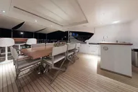 Luxurious 2018 Benetti 95 Delfino yacht deck with elegant dining area and modern amenities.