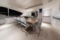 Luxurious deck of 2018 Benetti 95 Delfino yacht with elegant dining area.