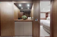 Luxurious interior of 2018 Benetti 95 Delfino yacht with elegant wood paneling and modern decor.