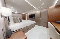 Luxurious bedroom interior of 2018 Benetti 95 Delfino yacht, featuring modern design and elegant furnishings.