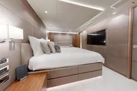 Luxurious bedroom interior on 2018 Benetti 95 Delfino yacht, featuring modern design and elegant furnishings.