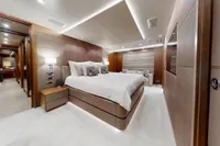 Luxurious bedroom interior of 2018 Benetti 95 Delfino yacht, featuring elegant design and modern amenities.