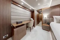 Luxurious interior of 2018 Benetti 95 Delfino yacht cabin with modern furnishings.
