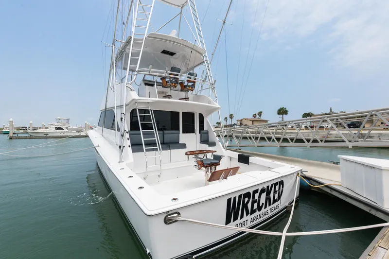  Yacht Photos Pics 2001 Viking 55 Convertible yacht docked at marina, named Wrecked, Port Aransas, Texas.