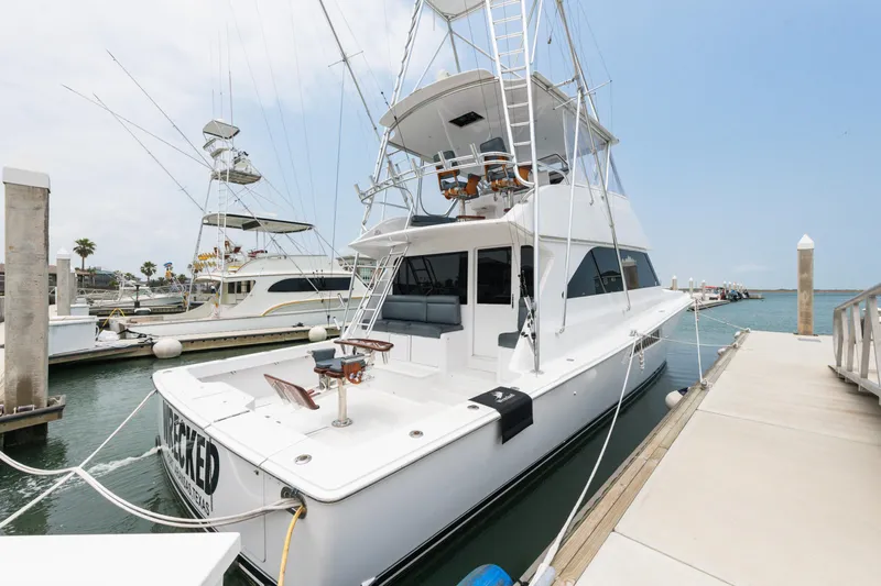  Yacht Photos Pics 2001 Viking 55 Convertible yacht docked at marina.