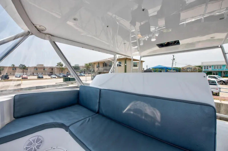  Yacht Photos Pics Interior seating area of 2001 Viking 55 Convertible yacht with blue cushions.