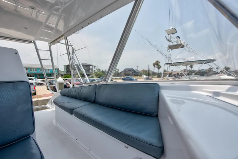  Yacht Photos Pics 2001 Viking 55 Convertible yacht interior with blue cushioned seating.