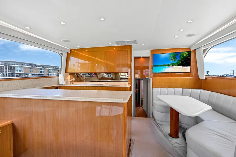 Yacht Photos Pics Interior of 2001 Viking 55 Convertible yacht with modern kitchen and dining area.
