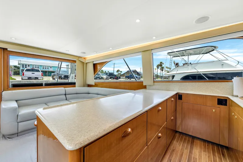  Yacht Photos Pics Interior of 2001 Viking 55 Convertible yacht with spacious seating and modern kitchen.