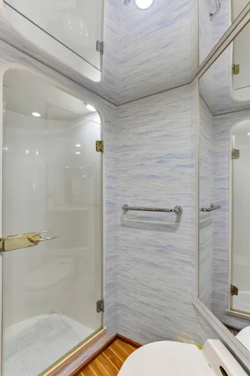  Yacht Photos Pics 2001 Viking 55 Convertible yacht bathroom with glass shower and modern fixtures.