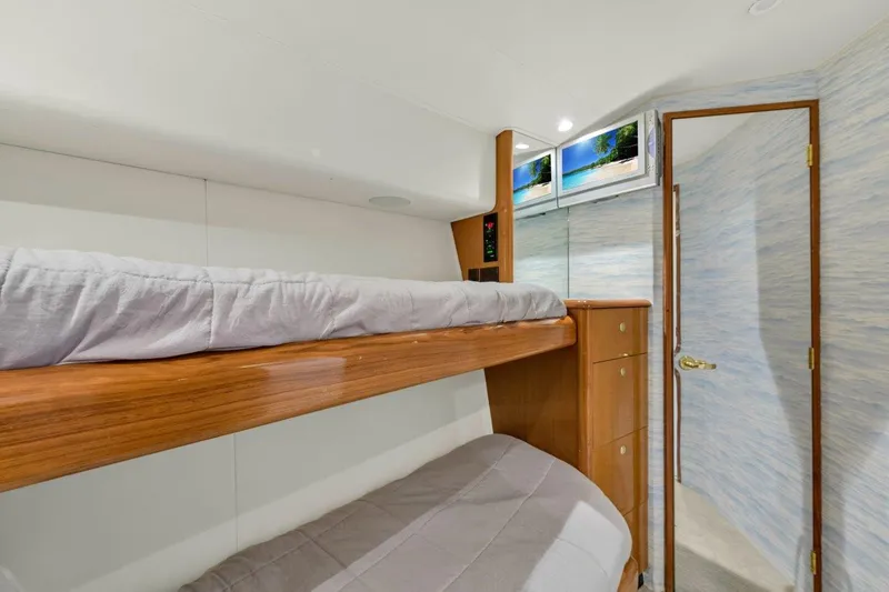  Yacht Photos Pics 2001 Viking 55 Convertible yacht interior with bunk beds and wooden cabinetry.