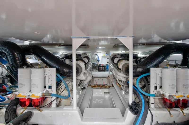  Yacht Photos Pics Engine room of a 2001 Viking 55 Convertible yacht with dual engines and filtration systems.