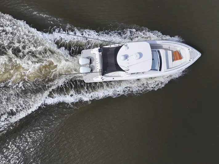  Yacht Photos Pics Aerial view of 2020 Regal 33 SAV boat cruising on water.