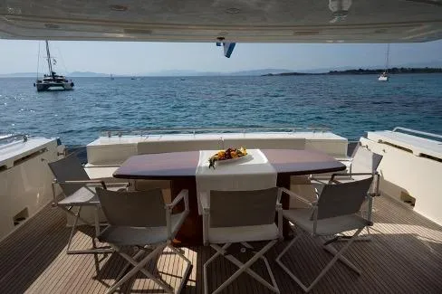  Yacht Photos Pics Luxury Ferretti Yachts 780, 2008 model, with elegant outdoor dining area overlooking the sea.