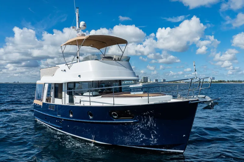 Wanderer Yacht Photos Pics 2016 Beneteau Swift Trawler 44 cruising on open water under a blue sky.