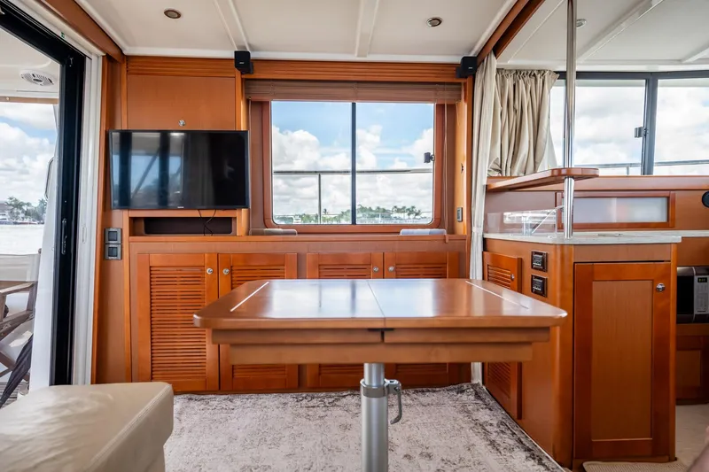 Wanderer Yacht Photos Pics Interior of 2016 Beneteau Swift Trawler 44 with wooden cabinetry and modern amenities.