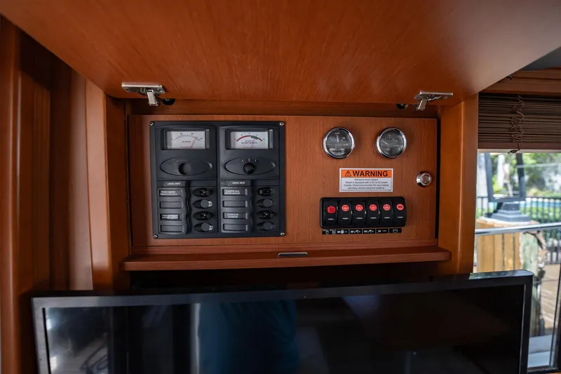 Wanderer Yacht Photos Pics Control panel inside 2016 Beneteau Swift Trawler 44, featuring gauges and switches.