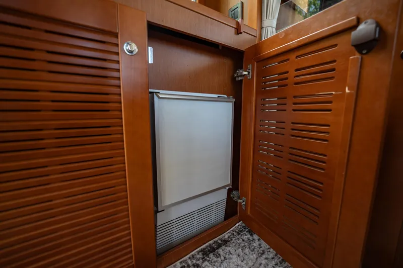 Wanderer Yacht Photos Pics 2016 Beneteau Swift Trawler 44 interior cabinet with built-in refrigerator.