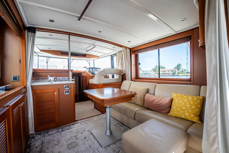 Wanderer Yacht Photos Pics Luxurious interior of 2016 Beneteau Swift Trawler 44 with comfortable seating and elegant wood finishes.