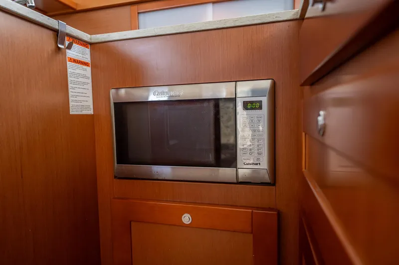 Wanderer Yacht Photos Pics Built-in microwave in 2016 Beneteau Swift Trawler 44 kitchen area.