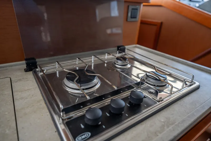 Wanderer Yacht Photos Pics Gas stove in 2016 Beneteau Swift Trawler 44 yacht kitchen.