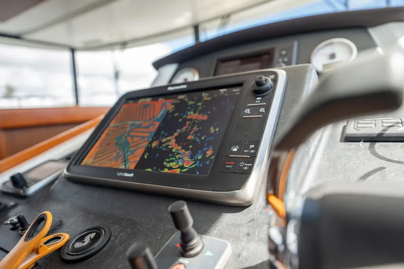 Wanderer Yacht Photos Pics 2016 Beneteau Swift Trawler 44 helm with navigation display and controls.