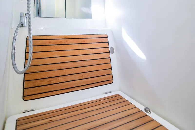 Wanderer Yacht Photos Pics 2016 Beneteau Swift Trawler 44 shower with wooden floor and modern fixtures.