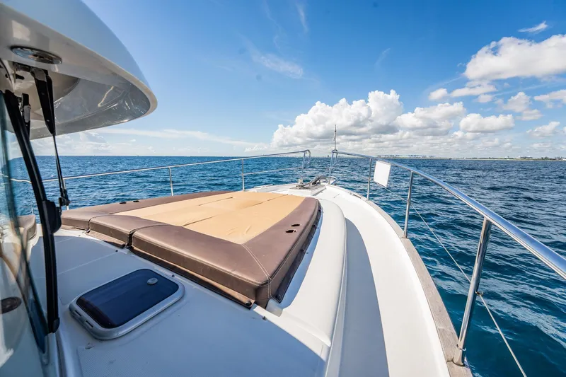 Wanderer Yacht Photos Pics 2016 Beneteau Swift Trawler 44 cruising on open sea under blue sky.
