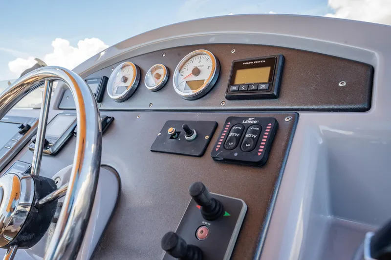 Wanderer Yacht Photos Pics Control panel of 2016 Beneteau Swift Trawler 44 with steering wheel and gauges.