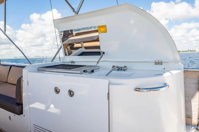 Wanderer Yacht Photos Pics Outdoor kitchen on 2016 Beneteau Swift Trawler 44, featuring grill and sink, ocean view.